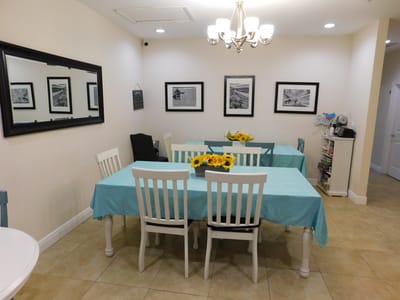 Bright dining area with tables and flower centerpieces