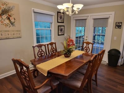 Dining area with wooden table and chairs