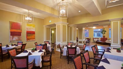 Dining room setup with tables and chairs