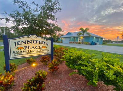 Exterior view of Jennifer's Place assisted living facility at sunset