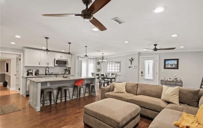 Bright and welcoming common area with a cozy sofa