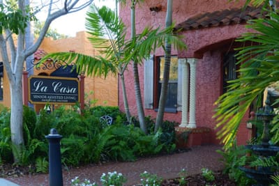 Entrance sign and landscaped area of La Casa Assisted Living
