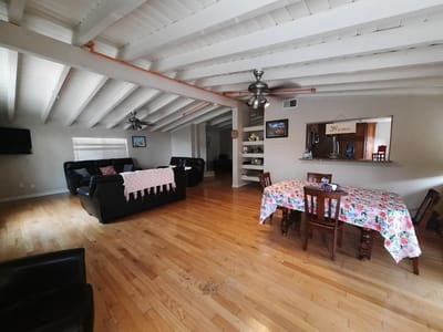 Interior view of a common area with seating and dining table