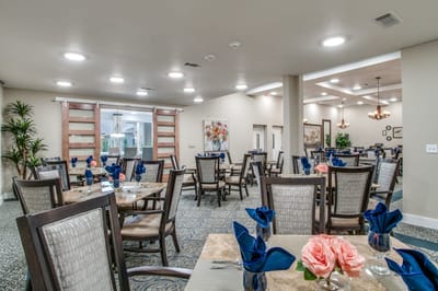 Dining room with neatly set tables and decorations
