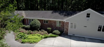 Exterior view of an assisted living facility with landscaping