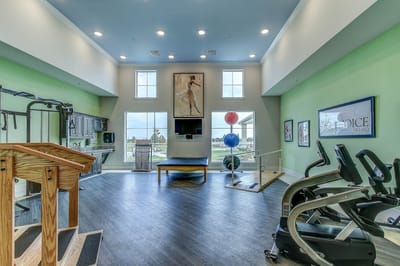 Interior view of a fitness room with exercise equipment
