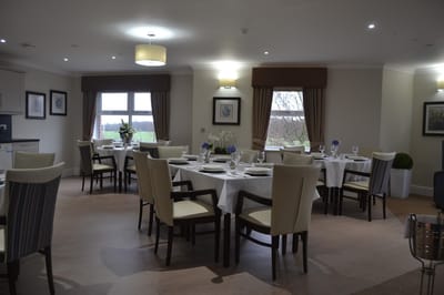 Bright dining area with elegantly set tables