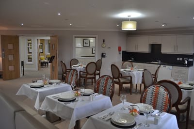 Dining area with tables set for a meal