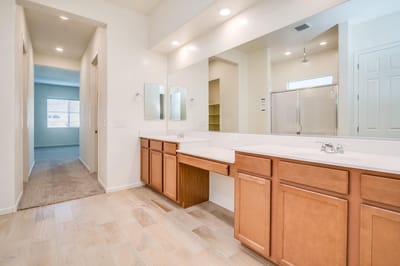 Well-lit bathroom vanity in a senior living unit