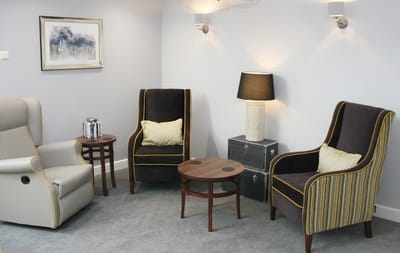 Cozy seating area with two armchairs and a lamp