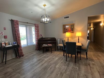 Bright lobby area with seating and piano