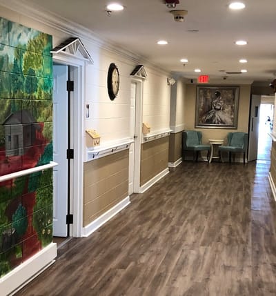 Interior hallway with decorative wall art and seating