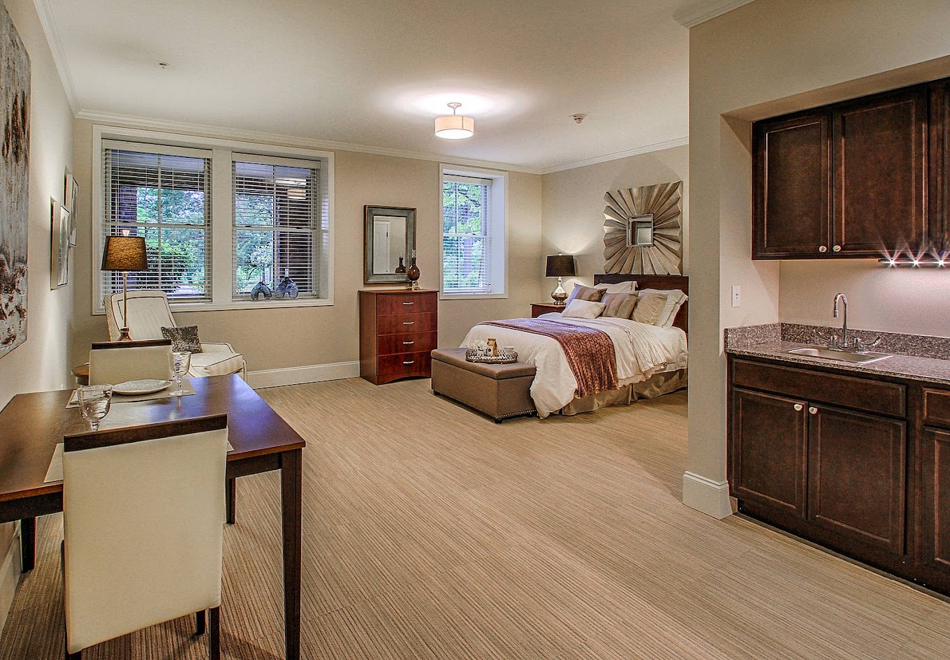 Comfortable resident room with a bed and kitchenette