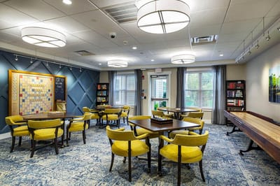 Bright activity room with tables and chairs
