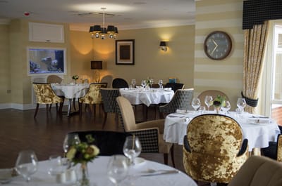 Elegant dining room with well-set tables