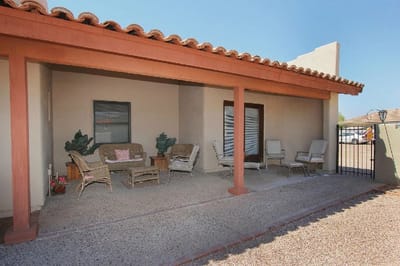 Outdoor seating area with chairs and plants