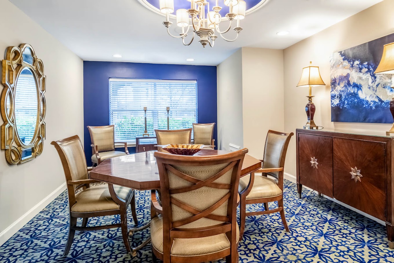 Elegant dining room with a chandelier and patterned carpet