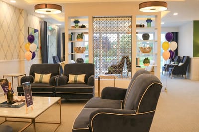 Bright common area with cozy seating and decorations