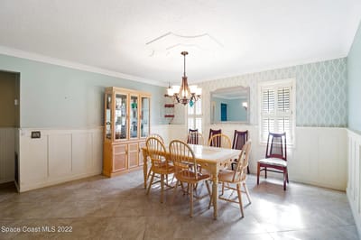 Bright dining room with wooden table and chairs