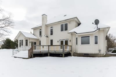 Exterior view of a senior living home covered in snow
