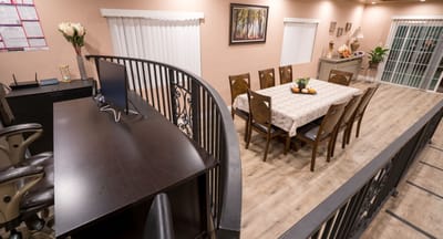 Overview of the dining area with a table and chairs