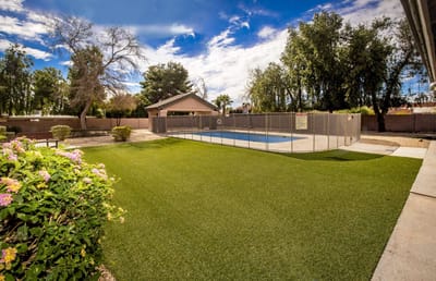 Outdoor area with a pool and landscaped garden