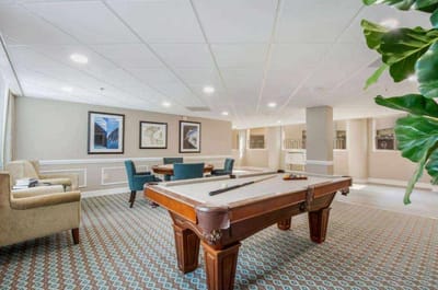 Interior common area with a pool table and seating