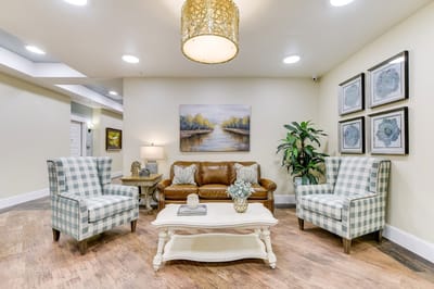 Well-decorated common area with seating and art