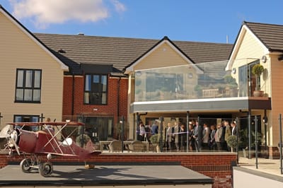 Exterior view of the facility with guests gathered outside