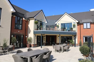 Outdoor courtyard area with seating and plants