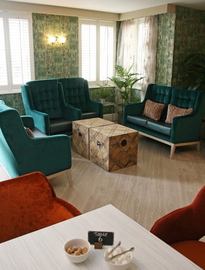 A cozy common area with teal seating