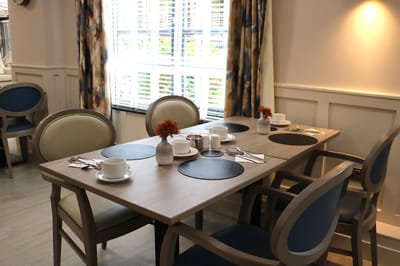 Dining area set up with cups and plates
