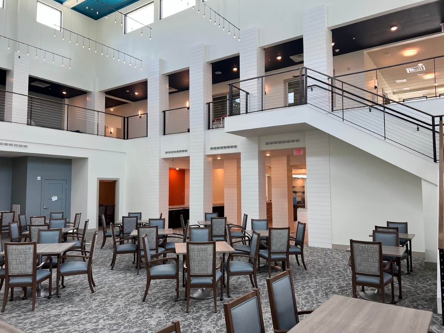 Bright common area with seating and open design