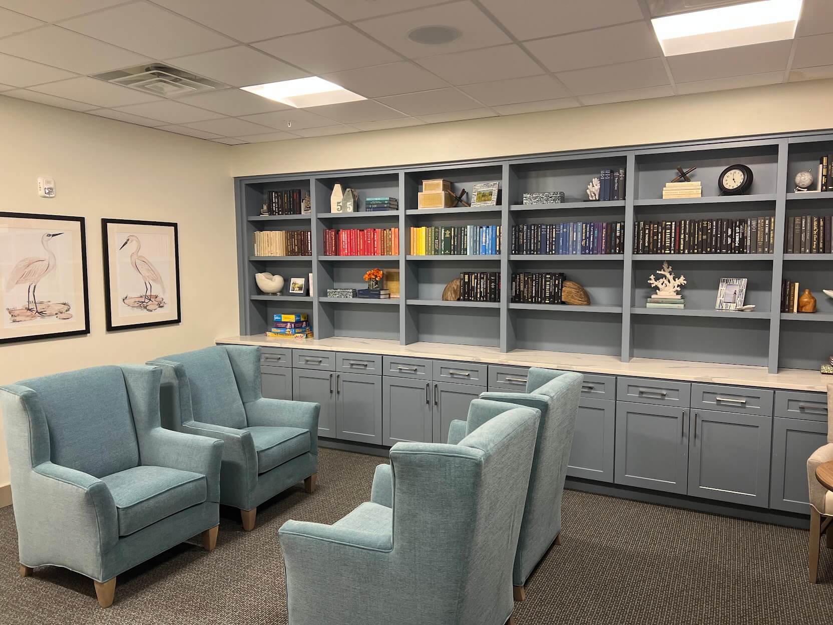 Cozy common area with comfortable seating and bookshelves