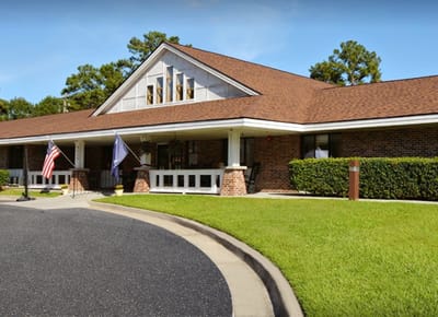 Exterior view of the facility with gardens