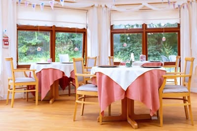 Bright dining area with tables and chairs