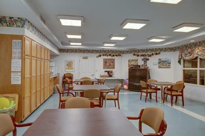 Interior view of a common area with tables and chairs