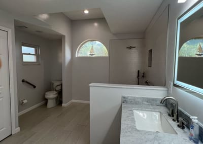 Modern bathroom with a walk-in shower and marble countertop