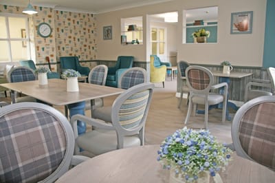 Bright common area with seating and floral decor