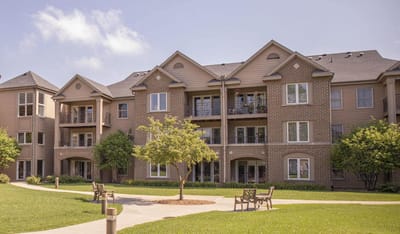 Exterior view of Westwood Trails building with landscaping.