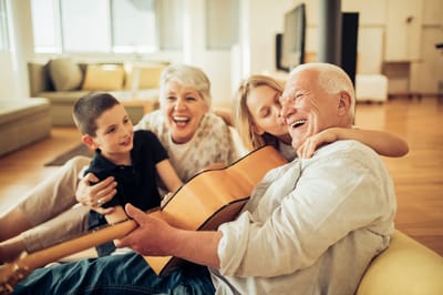 Residents enjoying music and laughter together.