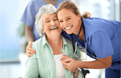 Caregiver and resident sharing a joyful moment