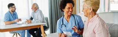 Cherokees Angel Personal Care Home, Nursing Home in Canton, GA — Nurse interacting with a smiling senior resident