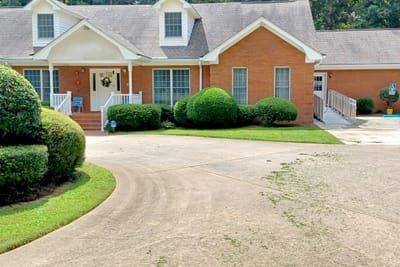 Cherokees Angel Personal Care Home, Nursing Home in Canton, GA — Exterior view of a senior living facility with gardens