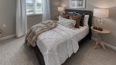 Cozy private bedroom with soft decor and natural light