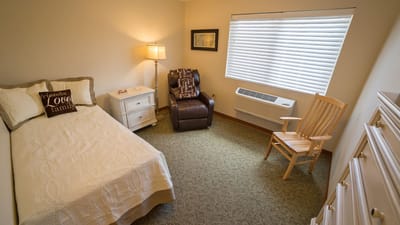 Cozy private room with bed and seating area