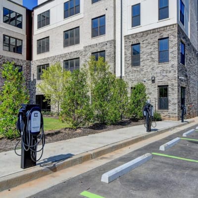 Exterior view of the facility with electric vehicle charging stations
