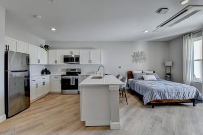Modern interior of a resident's suite with kitchenette