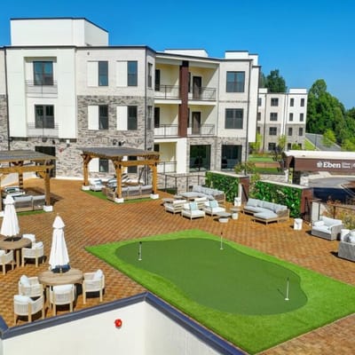 Outdoor area with seating and putting green at Eben Silver Town