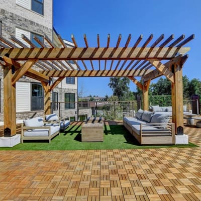Outdoor seating area with pergola and lounge furniture